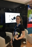 Photo of a girl manning a trade show installation